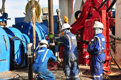 image of men working on oil rig