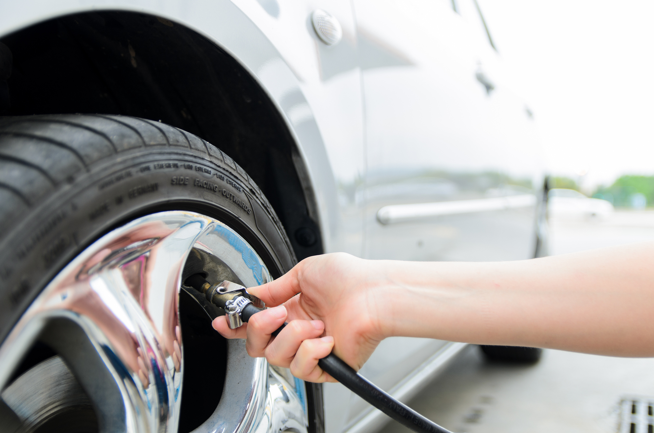 image of car getting air in tire