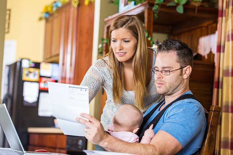 Man and wife looking at life insurance policy